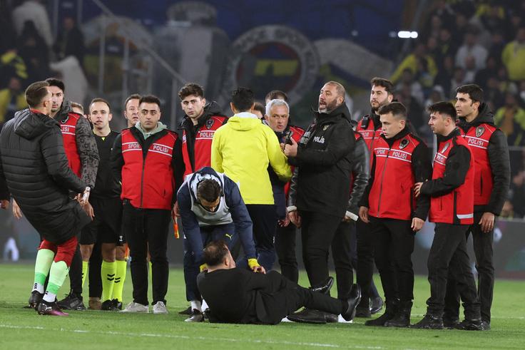 Mourinho appeared to pinch Okan Buruk s nose who then fell dramatically to the ground. Photo by Murat Akbas DIA Images