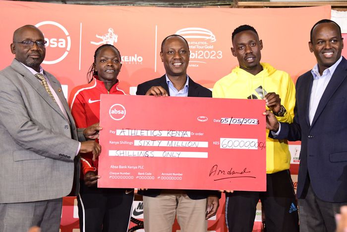 From the left: AK Nairobi region chair Banaba Korir, Mary Moraa, Sports PS Jonathan Mueke, Wiseman Were and Absa Bank Managing Director Abdi Mohamed