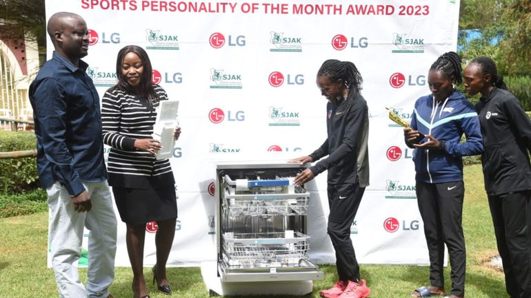 Faith Kipyegon checks the dishwasher she was awarded for winning Sports Personality for June.