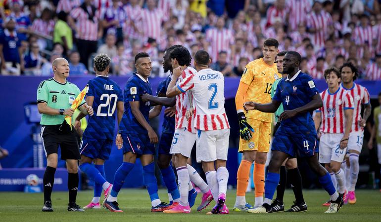 Mbappe battling with Paraguay players || Imago