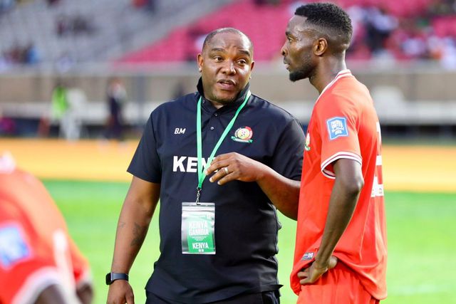 Harambee Stars coach Benni McCarthy with Collins Sichenje. Photo: FKF Media