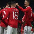Manchester United players celebrate a goal against Everton