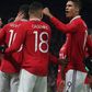 Manchester United players celebrate a goal against Everton