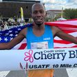 Hillary Bor after winning the USATF men's division 10 mile race