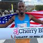Hillary Bor after winning the USATF men's division 10 mile race