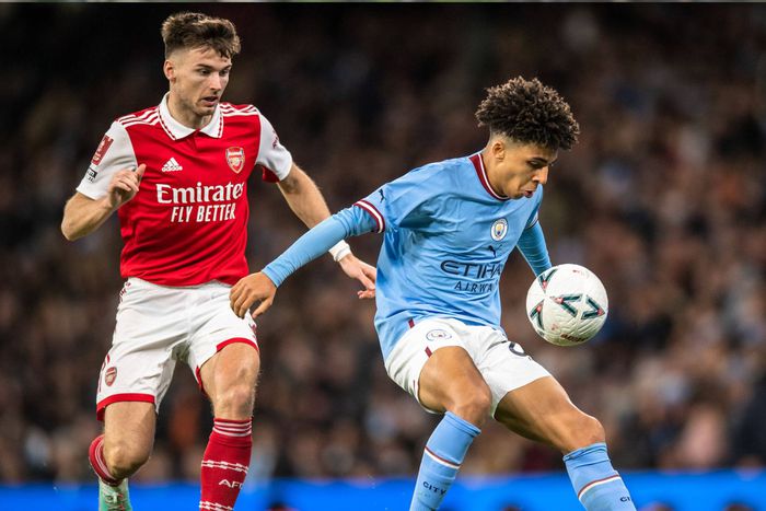 Manchester City's Rico Lewis vs Kieran Tierney of Arsenal.
