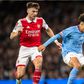 Manchester City's Rico Lewis vs Kieran Tierney of Arsenal.