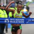 Caroline Rotich cuts the tape at the 2015 Boston Marathon