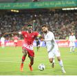 Olunga (left) in match against Iran