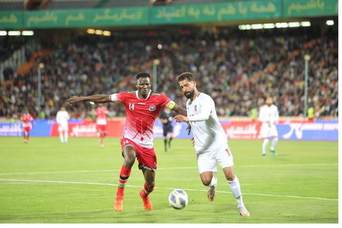 Olunga (left) in match against Iran