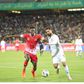 Olunga (left) in match against Iran