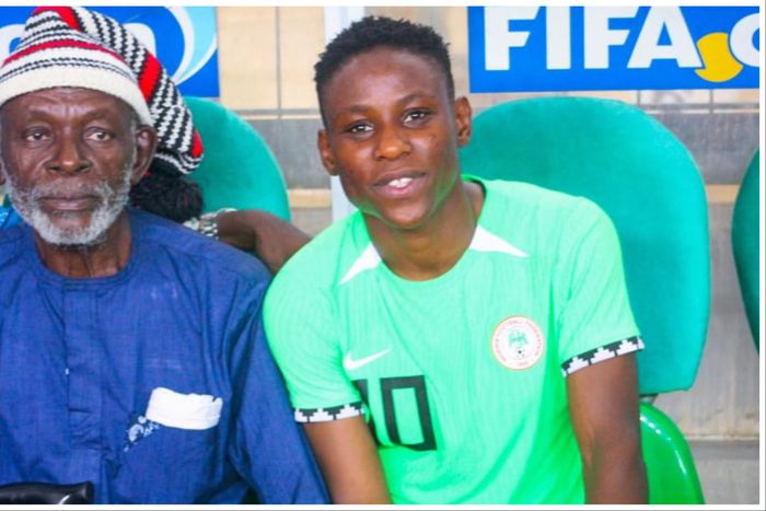 Super Falcons of Nigeria star Christy Ucheibe celebrates father after win against South Africa in Abuja.