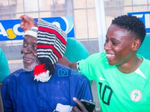 Super Falcons of Nigeria star Christy Ucheibe celebrates father after win against South Africa in Abuja.