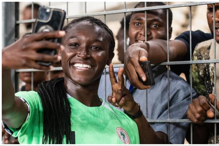 England-born star Rinsola Babajide celebrates Super Falcons of Nigeria victory against South Africa with fans.