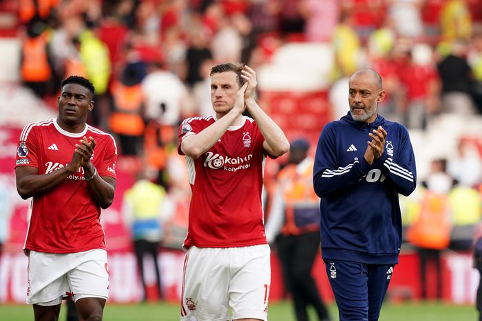 City Ground Nottingham Forest manager Nuno Espirito Santo (right) walks around the pitch with Taiwo Awoniyi (left) and Chris Wood (centre) as they applaud the fans after the Premier League || Image credit: Imago