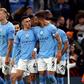 Kyle Walker, Phil Foden and Erling Haaland celebrate Manchester City goal.