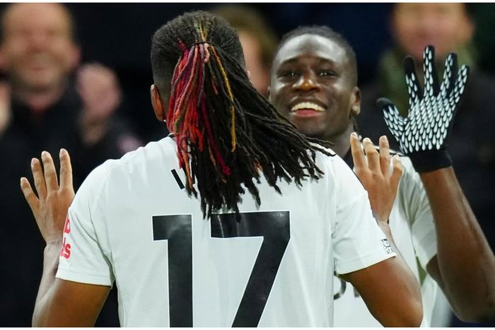 Calvin Bassey and Alex Iwobi during the game against Brighton.