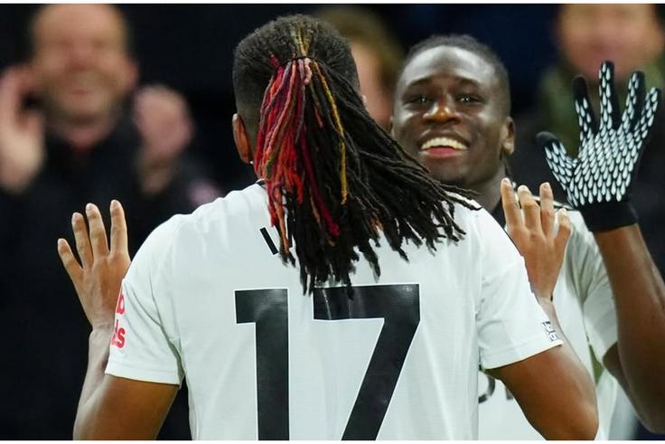Calvin Bassey and Alex Iwobi during the game against Brighton.