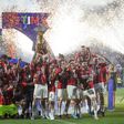 Serie A Alessio Romagnoli of AC Milan lifts the Scudetto trophy as players of AC Milan celebrate during during the award ceremony after the Serie A football match between US Sassuolo and AC Milan.