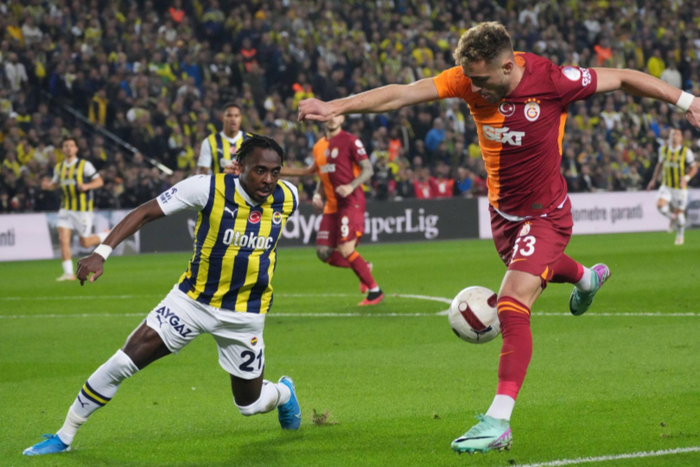 Bright Osayi Samuel (21) of Fenerbahce and Baris Alper Yilmaz of Galatasaray during the Turkish Super League Derby match between Fenerbahce and Galatasaray || Image credit: Imago