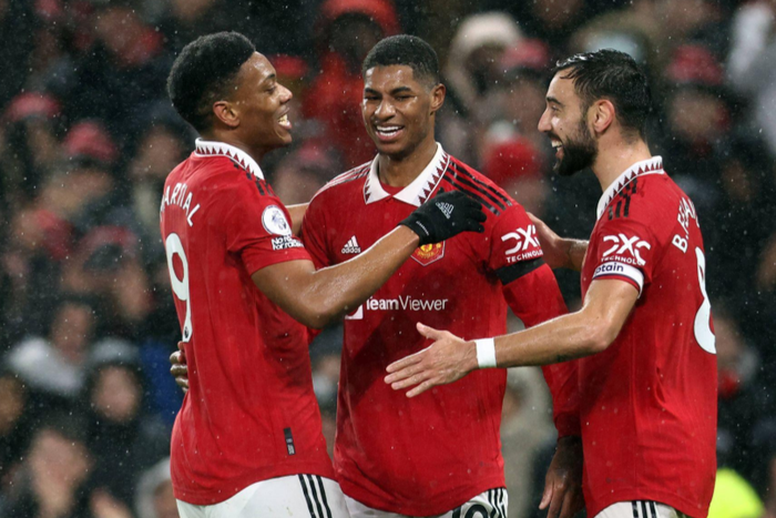Anthony Martial of Manchester United (l) celebrates scoring their second goal with Marcus Rashford (c) and Bruno Fernandes of Manchester United (r) during the Premier League match at Old Trafford || Image credit: Imago