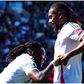 Calvin Bassey celebrates with Alex Iwobi after his milestone display for Fulham against Liverpool.