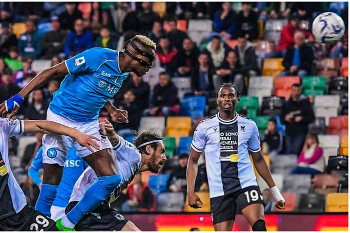 Victor Osimhen towers home a header against Super Eagles goalkeeper Maduka Okoye in the Serie A.