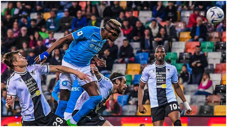 Victor Osimhen towers home a header against Super Eagles goalkeeper Maduka Okoye in the Serie A.