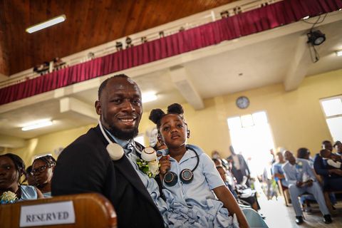 His Legacy - Olympic legend Usain Bolt takes comfort in his children after father's funeral