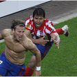 Diego Forlan and Kun Aguero celebrate for Atletico Madrid.
