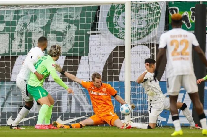 Victor Boniface watches on vs Wolfsburg.