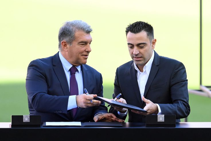 Barcelona president Joan Laporta with head coach Xavi