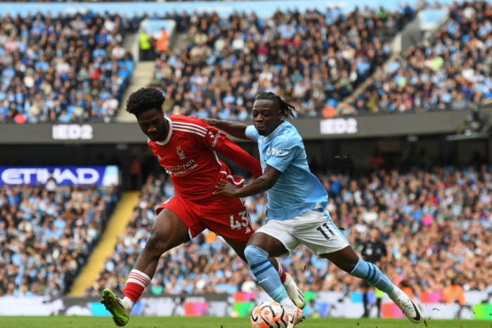 Ola Aina of Nottingham Forest battles with Jeremy Doku of Manchester City during the Premier League match between Manchester City and Nottingham || Image credit: Imago