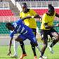 Tusker's Eric Zakayo and Charles Momanyi tackle Cliff Nyakeya.