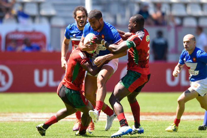 Kenya Sevens players tackling a France player.