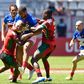 Kenya Sevens players tackling a France player.