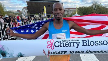 Kenyan-born Hillary Bor reacts to setting new American 10-mile record