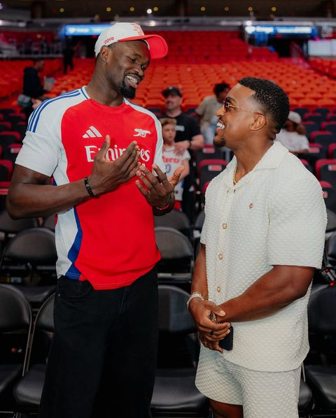 Nigerian NBA Star Adem Bona Okoro Teams Up with Fitness Influencer Ashton Hall at Miami Heat win against Philadelphia 76ers.