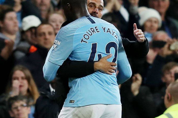 Pep Guardiola and Yaya Toure in an embrace.