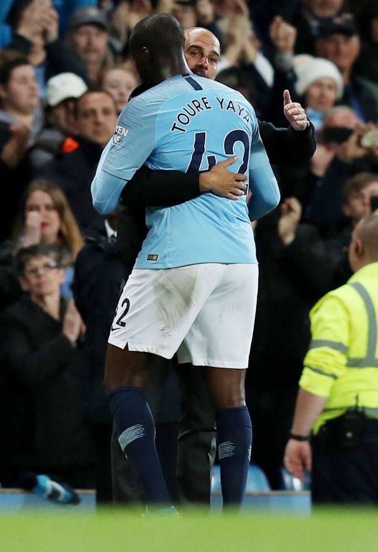 Pep Guardiola and Yaya Toure in an embrace.