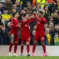 Liverpool s Curtis Jones (C) celebrates with team-mates Darwin Nunez (L) and Cody Gakpo (R) after scoring the first goal during the FA Cup 4th Round match between Liverpool FC and Norwich City FC at Anfield. (Photo by David Rawcliffe Propaganda)