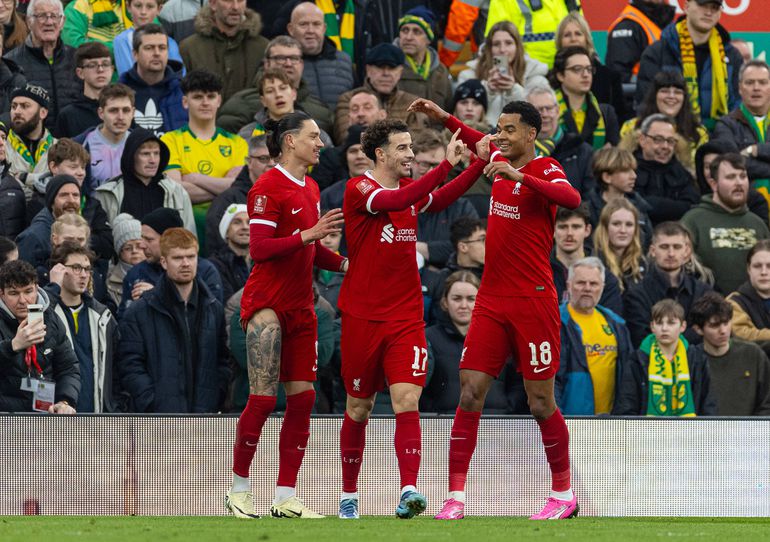 Liverpool s Curtis Jones (C) celebrates with team-mates Darwin Nunez (L) and Cody Gakpo (R) after scoring the first goal during the FA Cup 4th Round match between Liverpool FC and Norwich City FC at Anfield. (Photo by David Rawcliffe Propaganda)