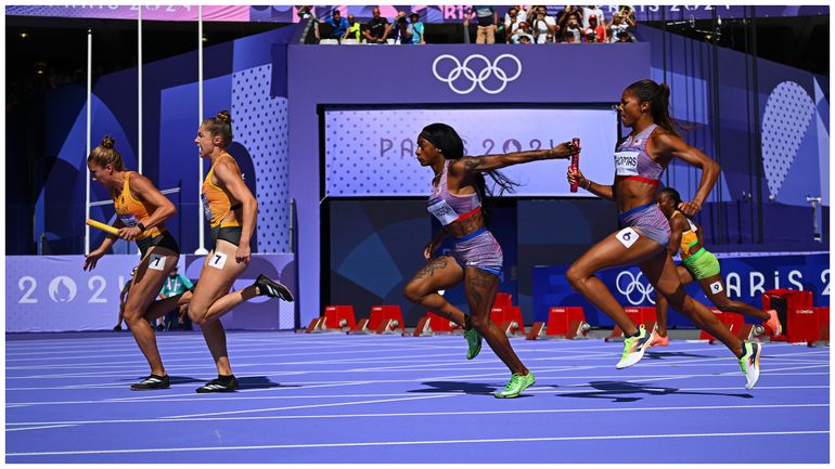 Sha'Carri Richardson and Gabby Thomas before the final lap in the relay heats.