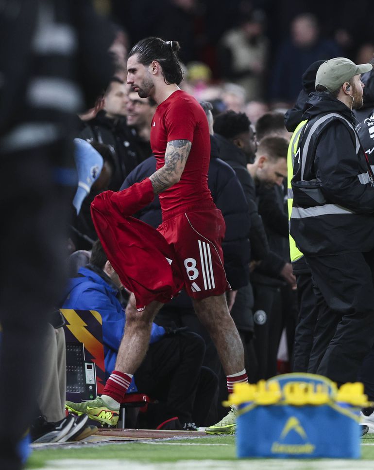 Dominik Szoboszlai takes the walk of shame at Anfield after he was sent off.