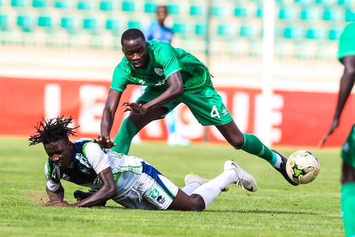 Gor Mahia Paul Ochuoga (top) tussle for the ball against KCB Erick Adem on January 4th 2023