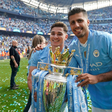Rodri of Manchester City (R) and Julian Alvarez of Manchester City celebrate with the Premier league trophy during the Premier League match at the Etihad Stadium, Manchester. Picture credit: Andrew Yates / Sportimage
