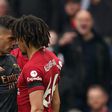Grani Xhaka of Arsenal and Trent Alexander-Arnold of Liverpool butting heads at Anfield.