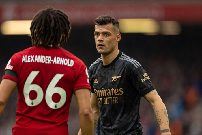 Arnold and Xhaka face off during the Arsenal vs Liverpool clash