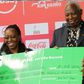 AK president Jack Tuwei receives cheque from Safaricom.