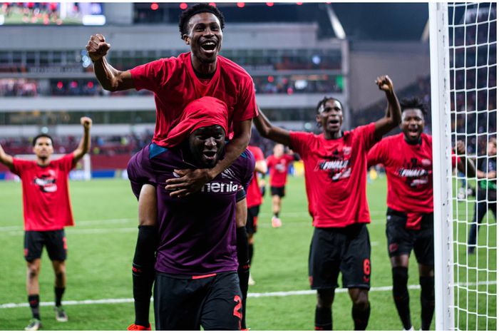 Victor Boniface and Nathan Tella celebrate a famous night for Bayer Leverkusen.